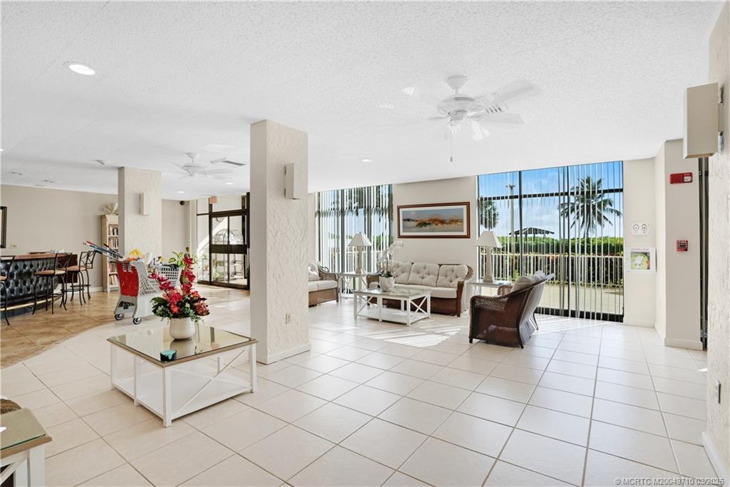 3200 North Hwy A1A, Unit 805 Fort Pierce, FL 34949 - Photo 40 of 43 a living room with furniture and a table