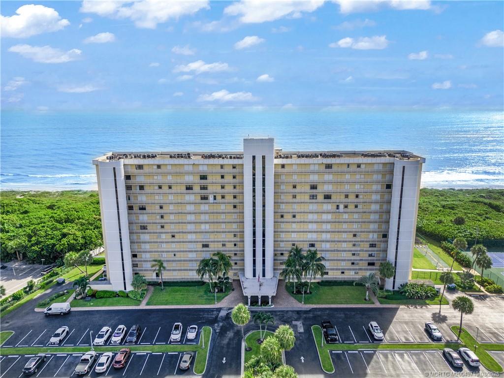 3200 North Hwy A1A, Unit 805 Fort Pierce, FL 34949 - Photo 4 of 43 a view of a building with a yard
