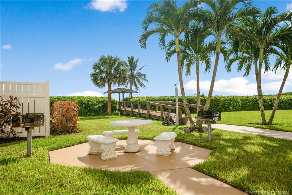 3200 North Hwy A1A, Unit 805 Fort Pierce, FL 34949 - Photo 41 of 43 a view of a backyard with swimming pool and sitting area