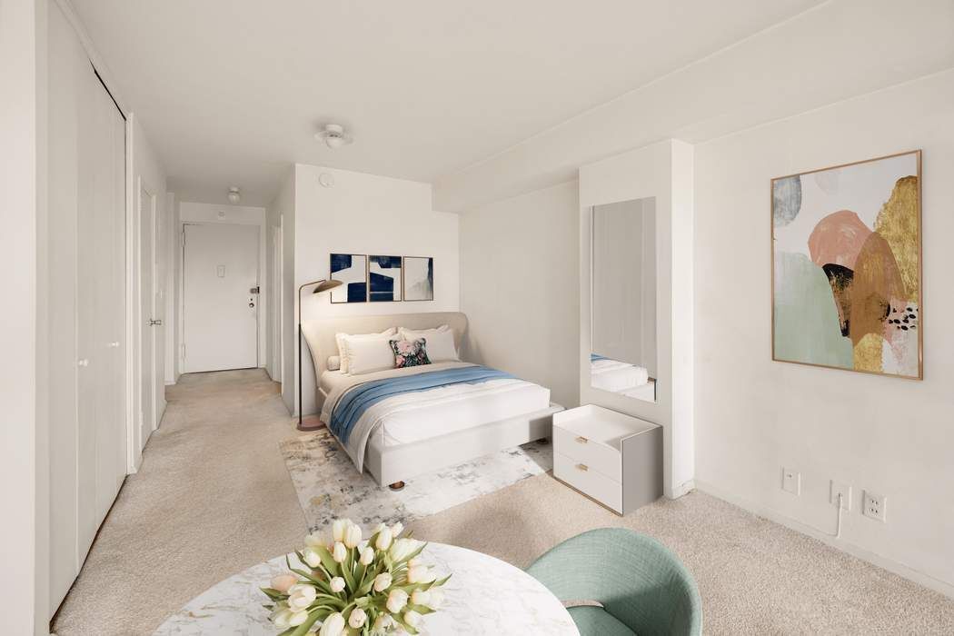 61 Jane Street, Unit 10N Manhattan, NY 10014 - Photo 5 of 13 a bedroom with a bed and a painting on the wall