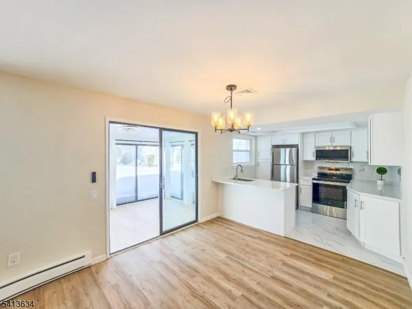 a view of a kitchen with microwave and stove