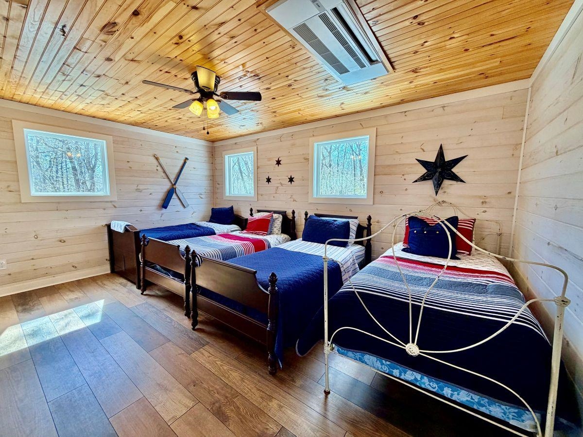 540 Muscatel Lane Counce, TN 38326 - Photo 18 of 29 a bedroom with bed and a chandelier