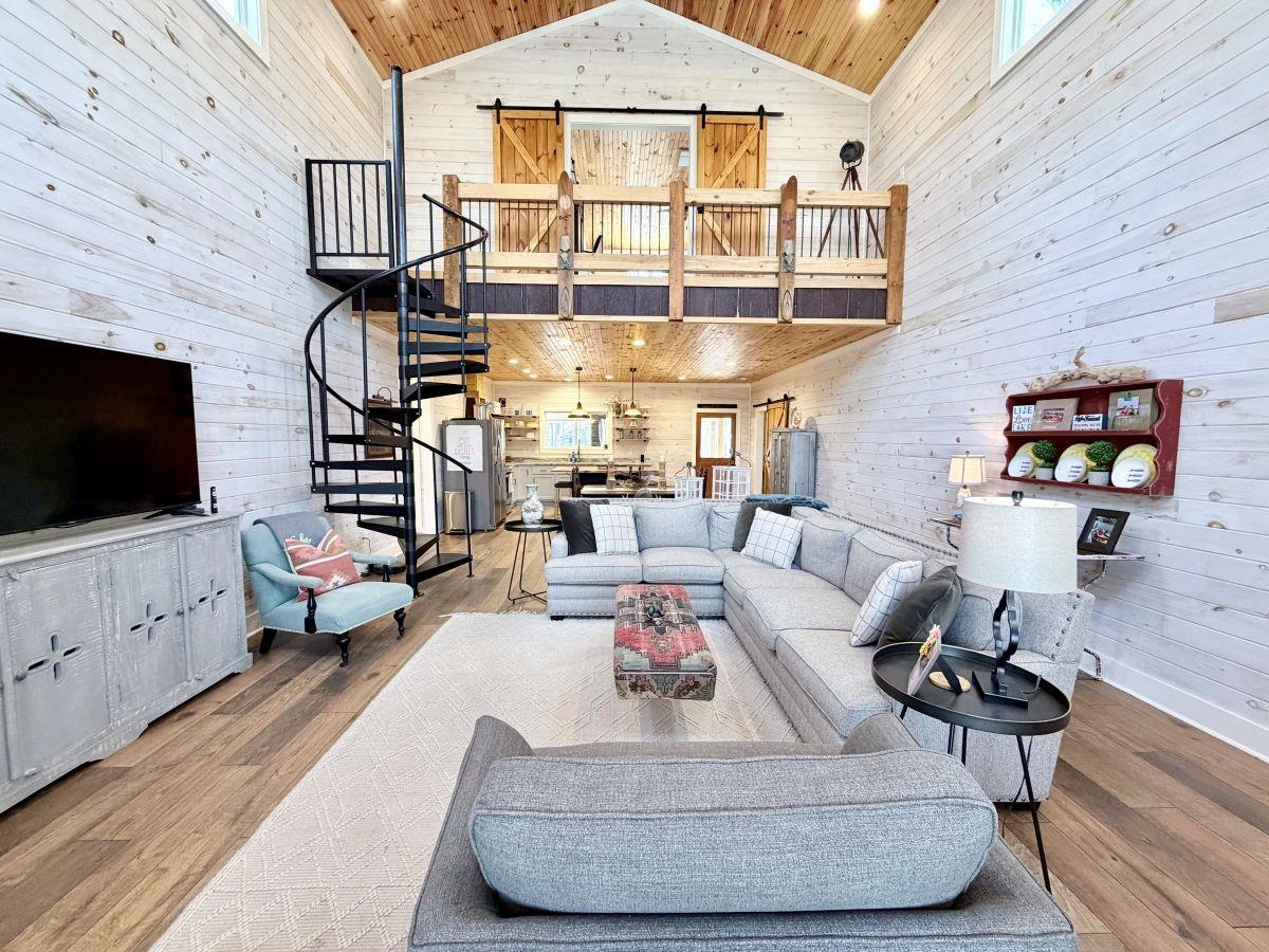 540 Muscatel Lane Counce, TN 38326 - Photo 29 of 29 a living room with furniture and a flat screen tv