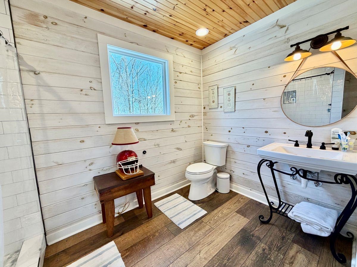 540 Muscatel Lane Counce, TN 38326 - Photo 20 of 29 a bathroom with a toilet a sink and mirror