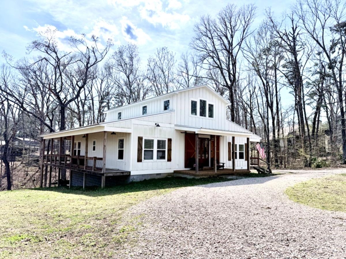540 Muscatel Lane Counce, TN 38326 - Photo 27 of 29 a view of a white house with a large tree in front of it