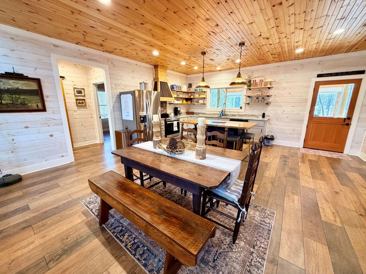 540 Muscatel Lane Counce, TN 38326 - Photo 4 of 29 a living room with a table chairs and a flat screen tv