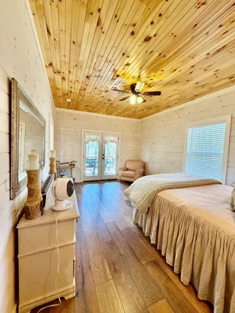 a bed room with a bed and a night stand