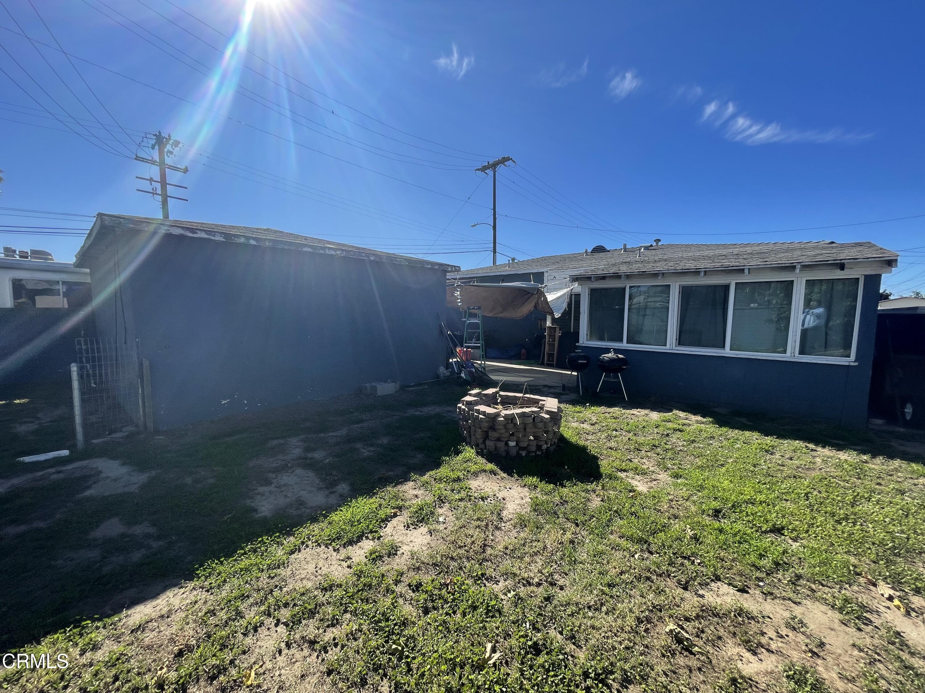 5084 Bradfield Place Oxnard, CA 93033 - Photo 5 of 12 a view of a house with a yard