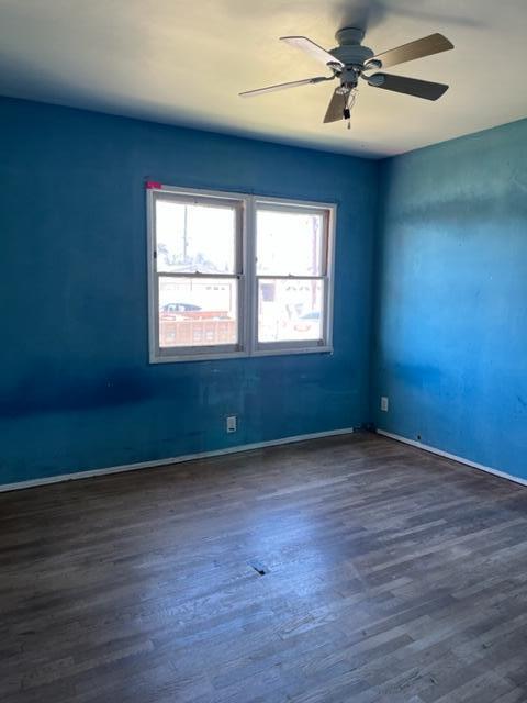 5084 Bradfield Place Oxnard, CA 93033 - Photo 9 of 12 an empty room with wooden floor fan and windows