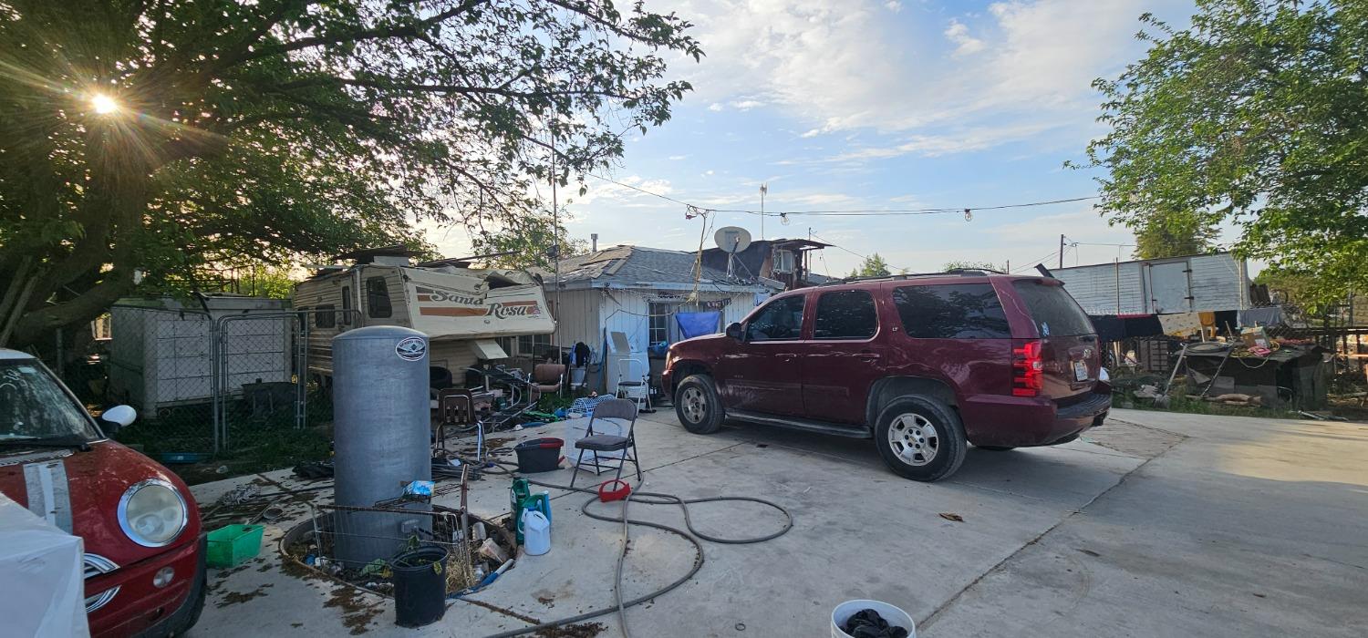 251 North Trinity Avenue Kerman, CA 93630 - Photo 2 of 4 a car parked in front of a house