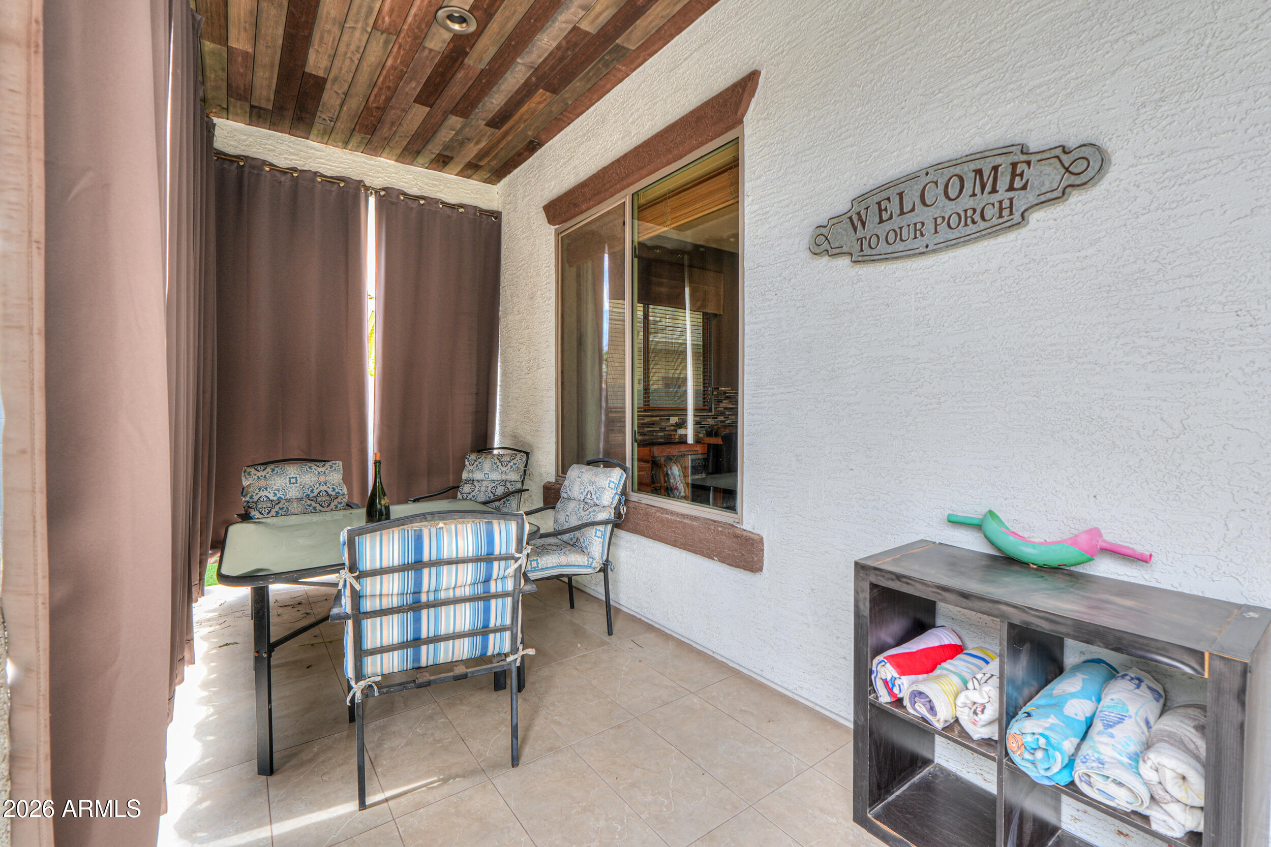 45247 West Jack Rabbit Trail Maricopa, AZ 85139 - Photo 58 of 75 a outdoor living space with furniture and a potted plant