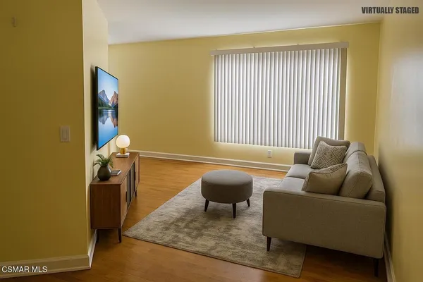 a living room with furniture and a window