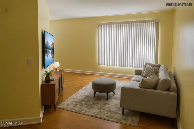 a living room with furniture and a window