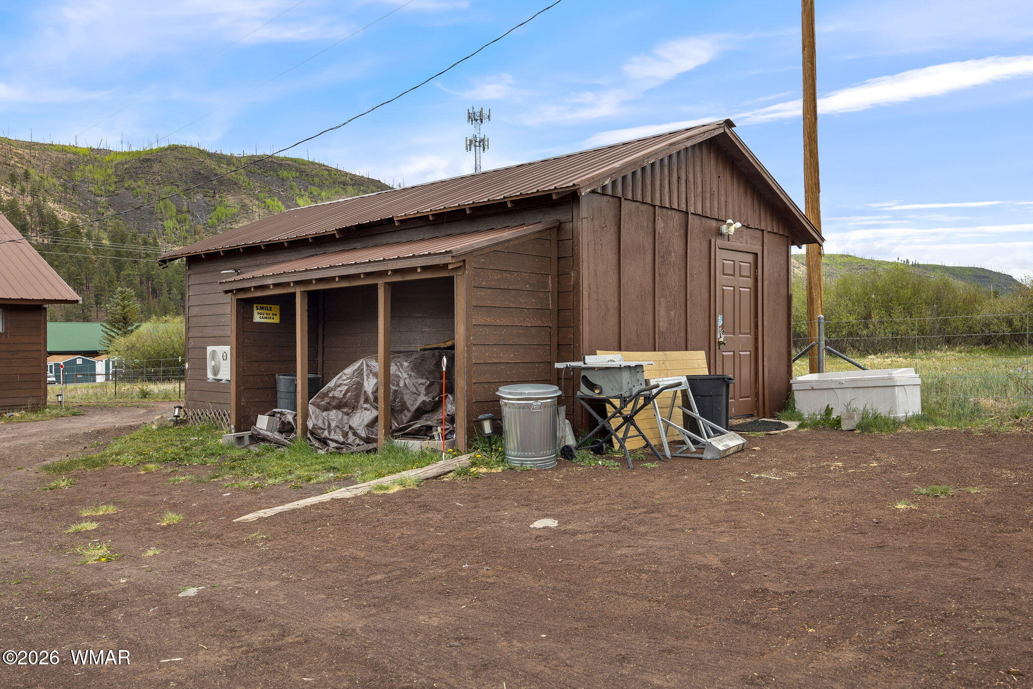 85 Main Street Greer, AZ 85927 - Photo 42 of 55 a view of a house with large patio and a yard