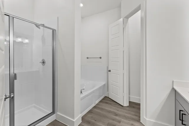 a bathroom with a glass shower door