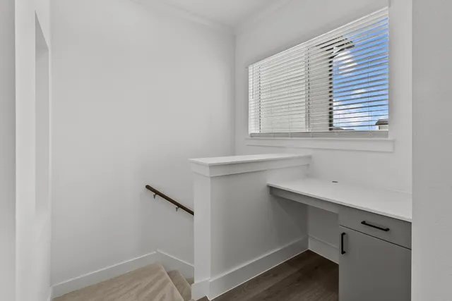 a bathroom with a sink and a window