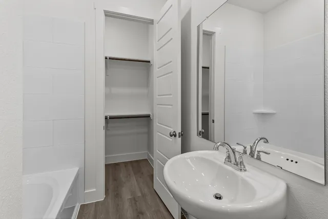 a bathroom with a sink and a tub