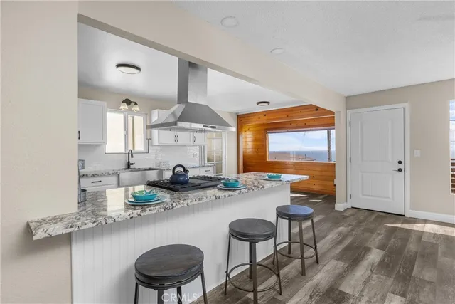 a kitchen with a table and chairs in it