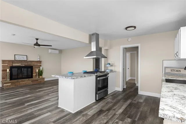 a kitchen with a stove and a refrigerator