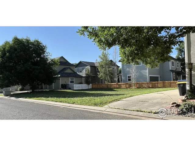 a house that has a tree in front of it