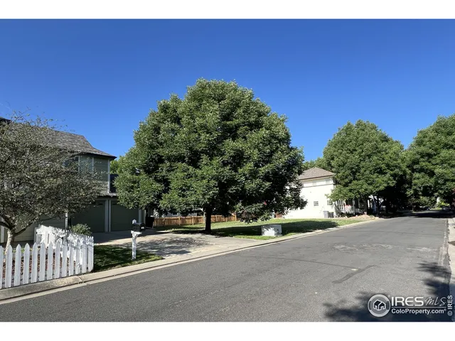 a view of a road with a building in the background