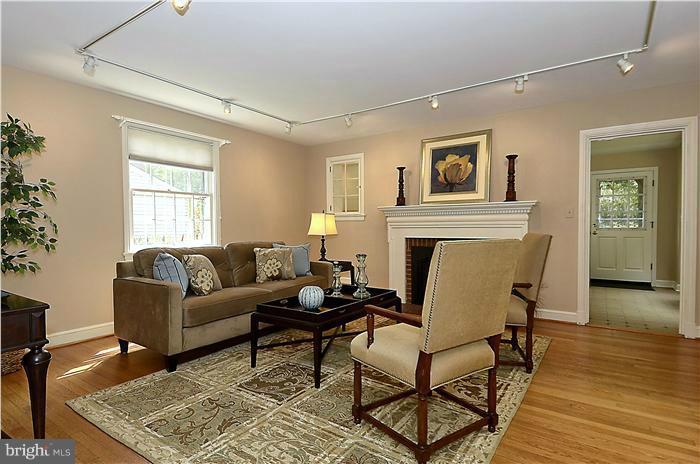 1912 Hanover Street Silver Spring, MD 20910 - Photo 7 of 29 a living room with furniture and a fireplace