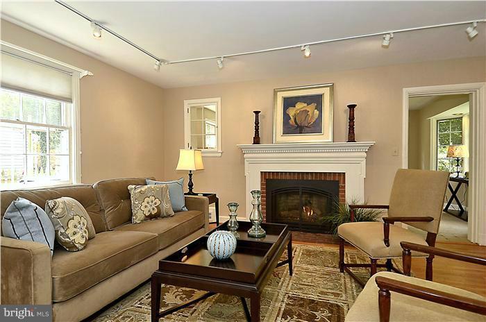 1912 Hanover Street Silver Spring, MD 20910 - Photo 8 of 29 a living room with furniture and a fireplace