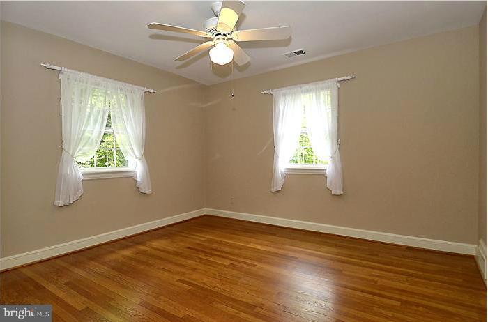 1912 Hanover Street Silver Spring, MD 20910 - Photo 10 of 29 a view of an empty room with wooden floor and a window