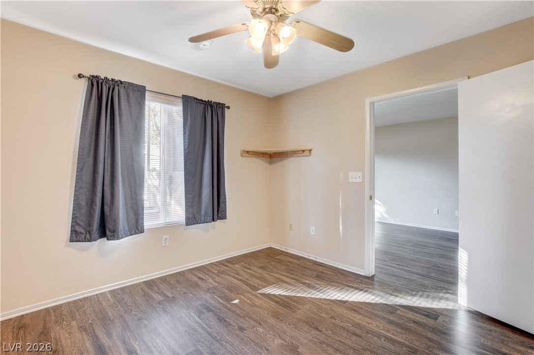 8070 West Russell Road, Unit 1064 Las Vegas, NV 89113 - Photo 17 of 35 Spare room with a ceiling fan and dark wood-style flooring