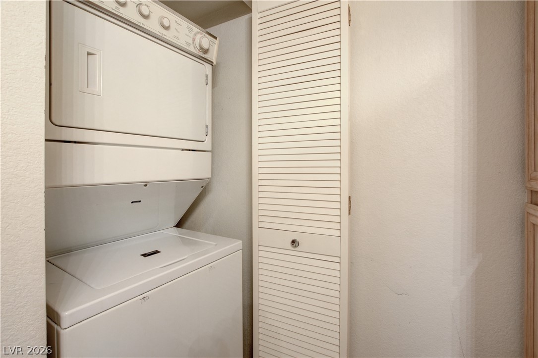 8070 West Russell Road, Unit 1064 Las Vegas, NV 89113 - Photo 22 of 35 Laundry area with stacked washer and dryer