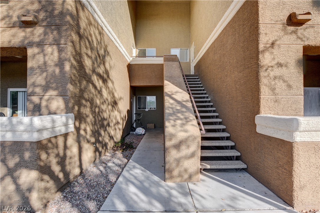 8070 West Russell Road, Unit 1064 Las Vegas, NV 89113 - Photo 3 of 35 Entrance to property featuring stucco siding