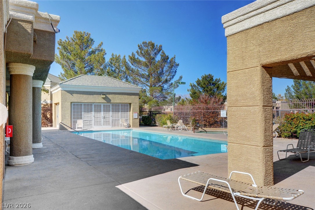 8070 West Russell Road, Unit 1064 Las Vegas, NV 89113 - Photo 32 of 35 Community pool with a patio area