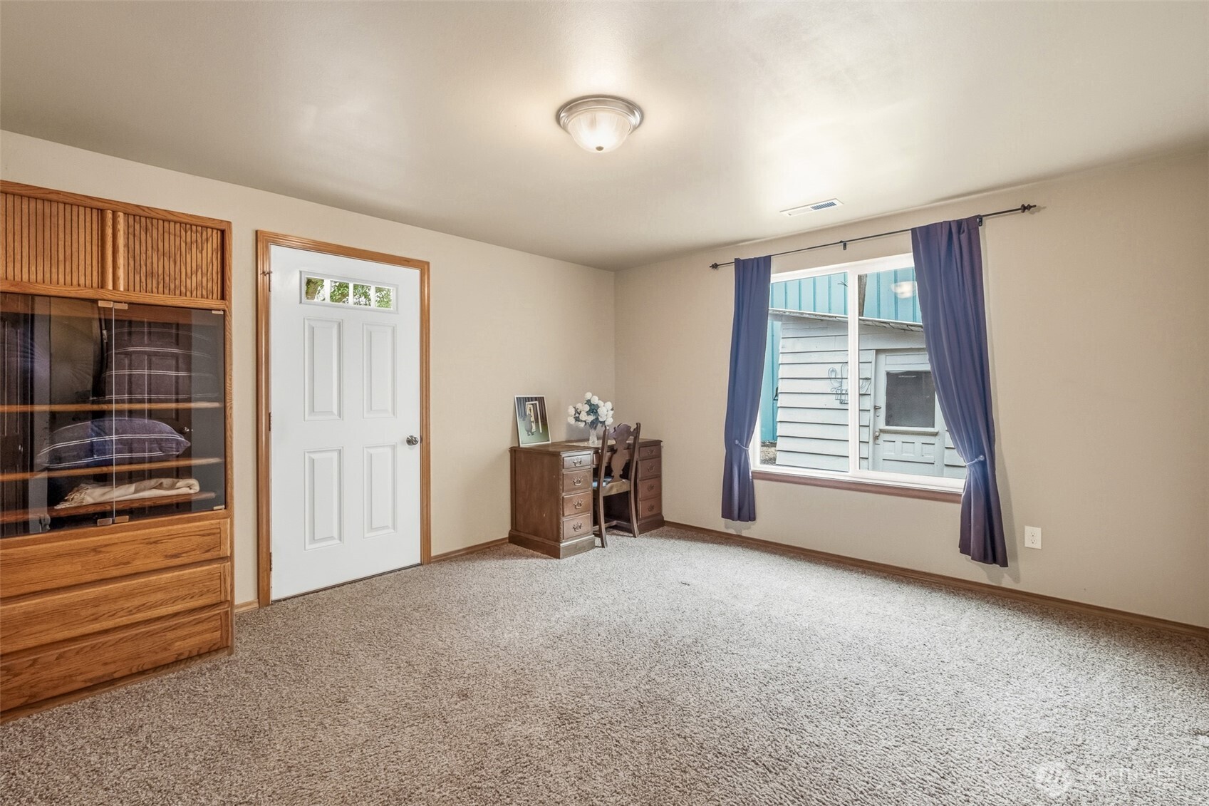 5197 Regan Road Cashmere, WA 98815 - Photo 20 of 29 a view of an empty room with furniture and a window