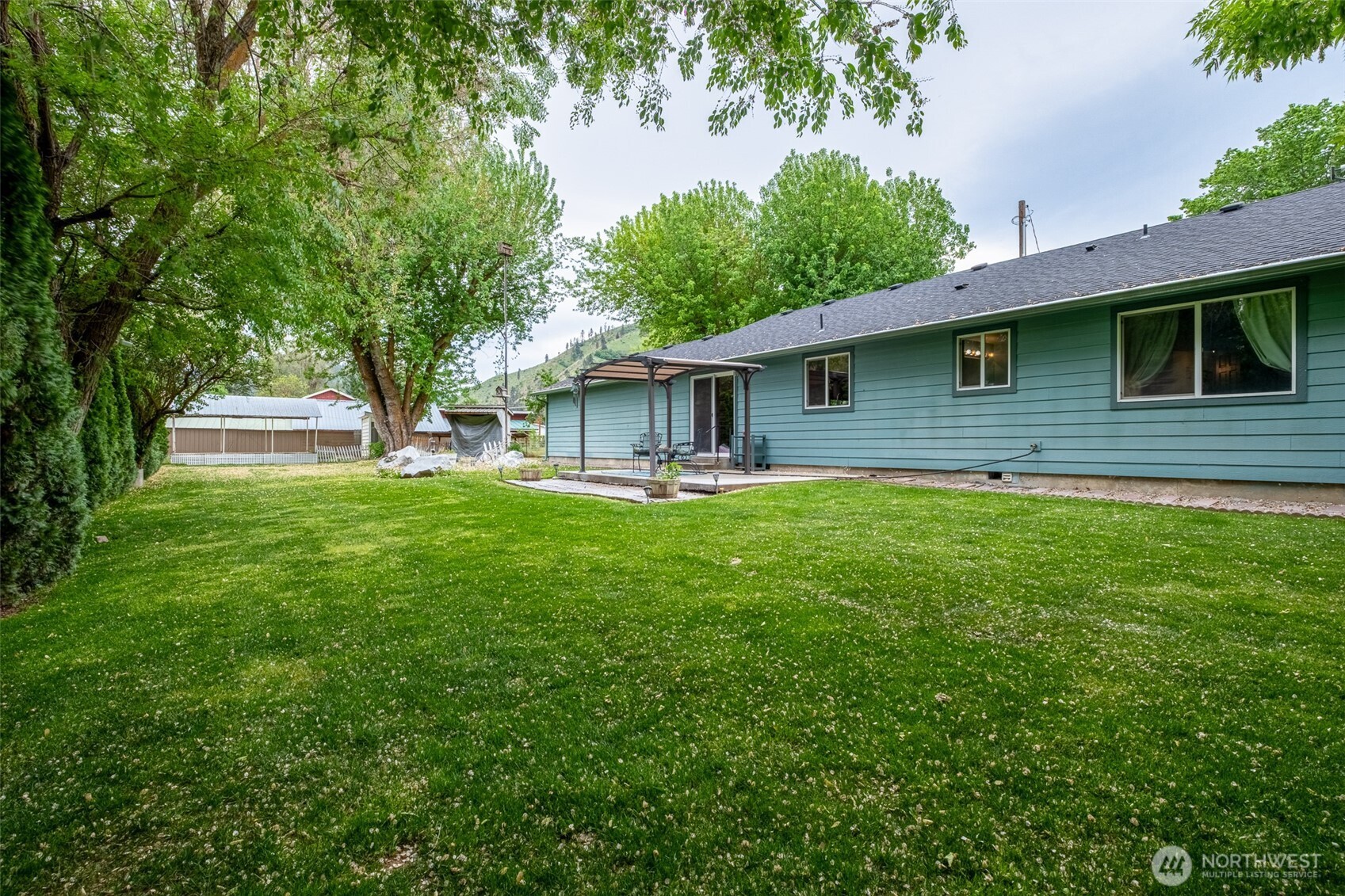 5197 Regan Road Cashmere, WA 98815 - Photo 27 of 29 a view of house with a yard