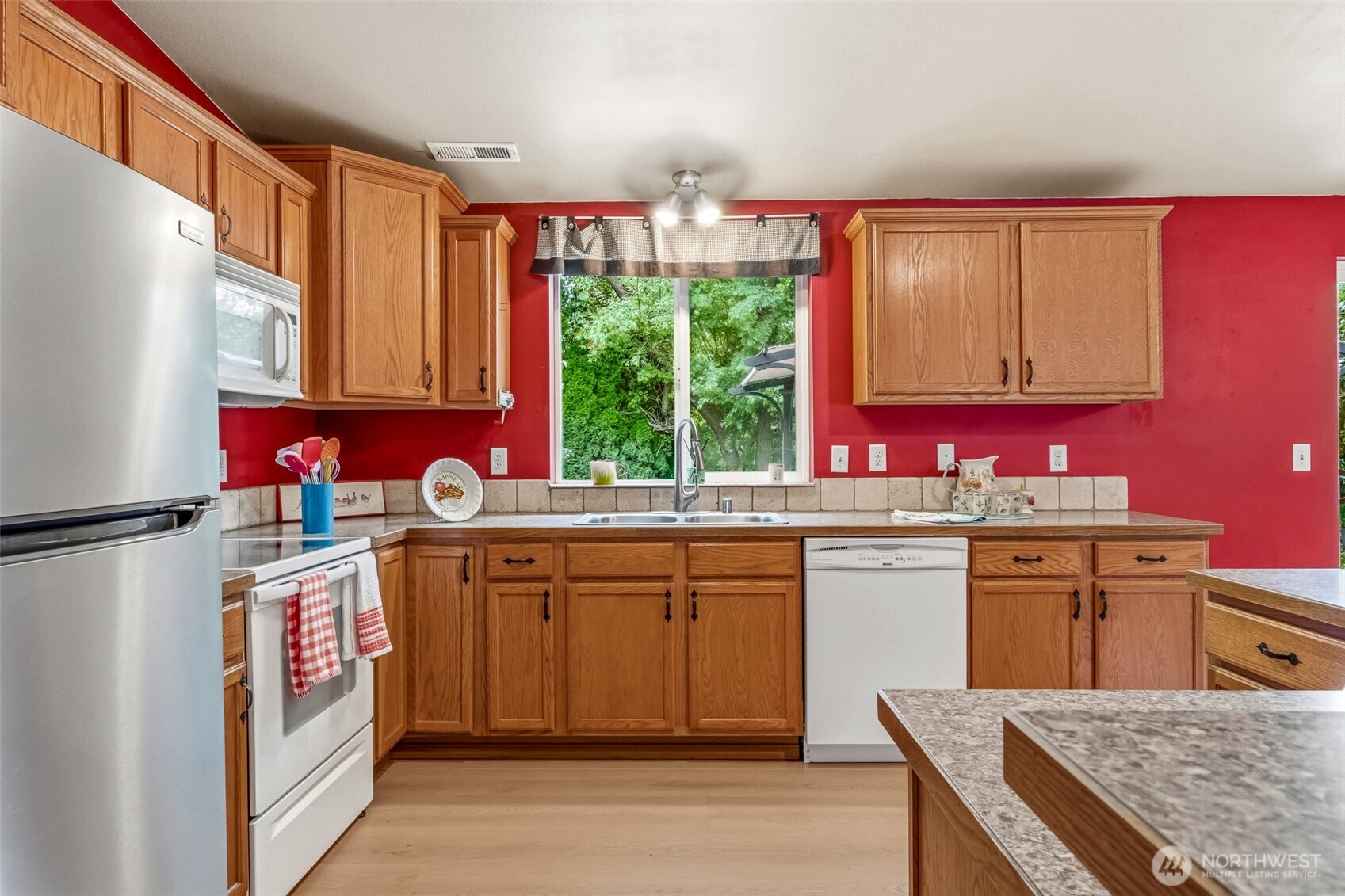 5197 Regan Road Cashmere, WA 98815 - Photo 8 of 29 a kitchen with stainless steel appliances granite countertop a stove a sink dishwasher and a refrigerator