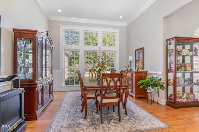 a view of a room with furniture and wooden floor