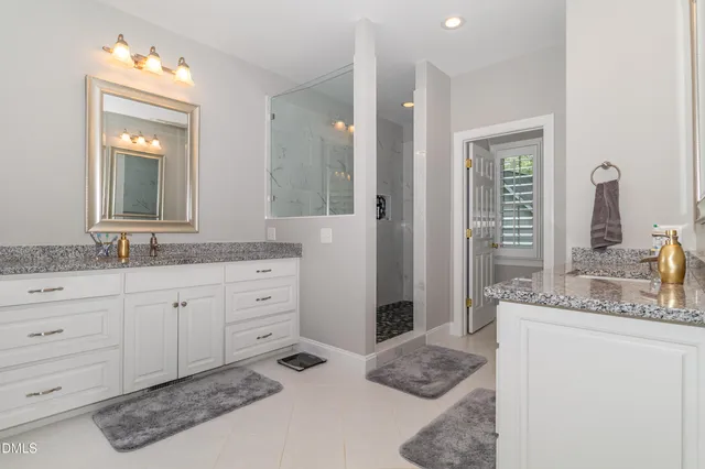 a bedroom with a bed and glass window