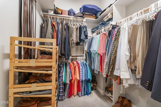 a spacious bathroom with a granite countertop sink and a mirror