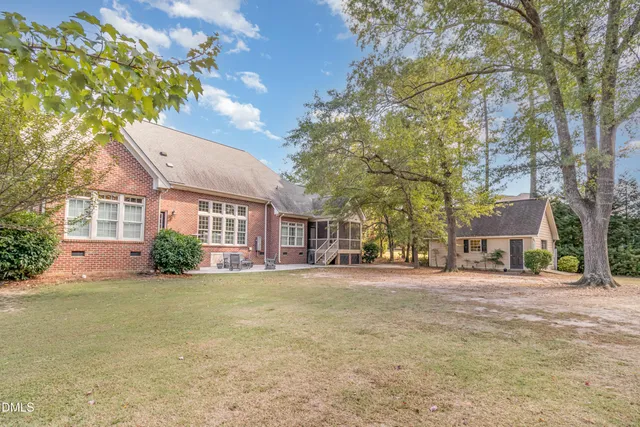 a view of house with outdoor seating space