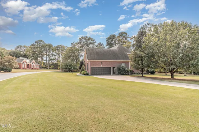 a view of a house with basketball court