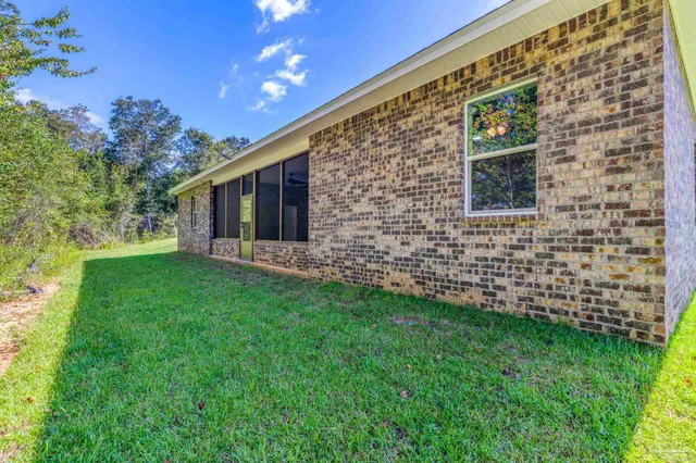 a backyard of a house with lots of green space