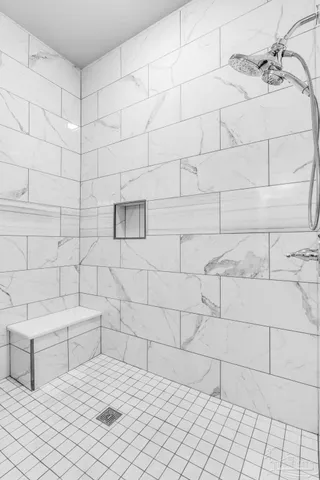 a bathroom with a bathtub and shower