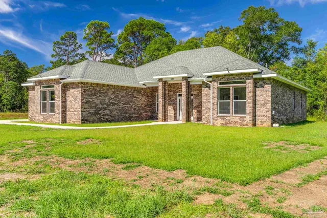 front view of a house with a yard