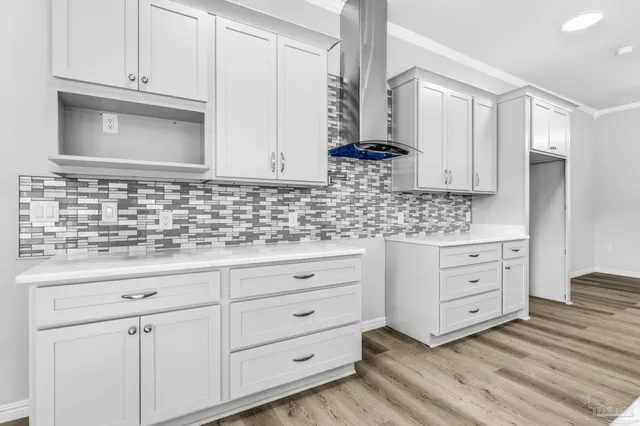 a bathroom with a sink vanity granite and a mirror