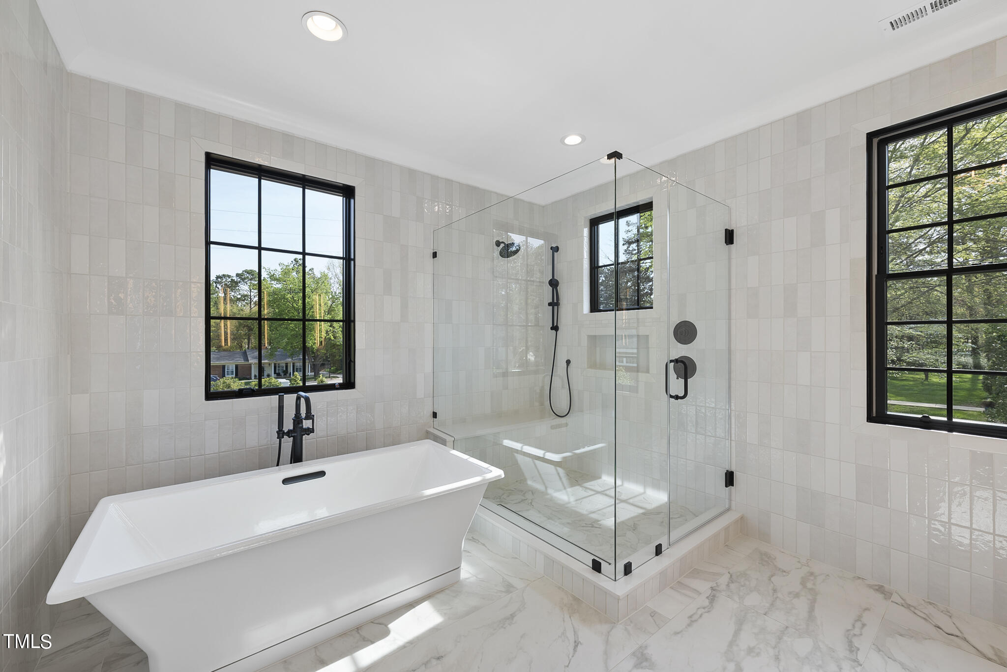 3305 Founding Place Raleigh, NC 27612 - Photo 29 of 100 a bathroom with a tub and a shower