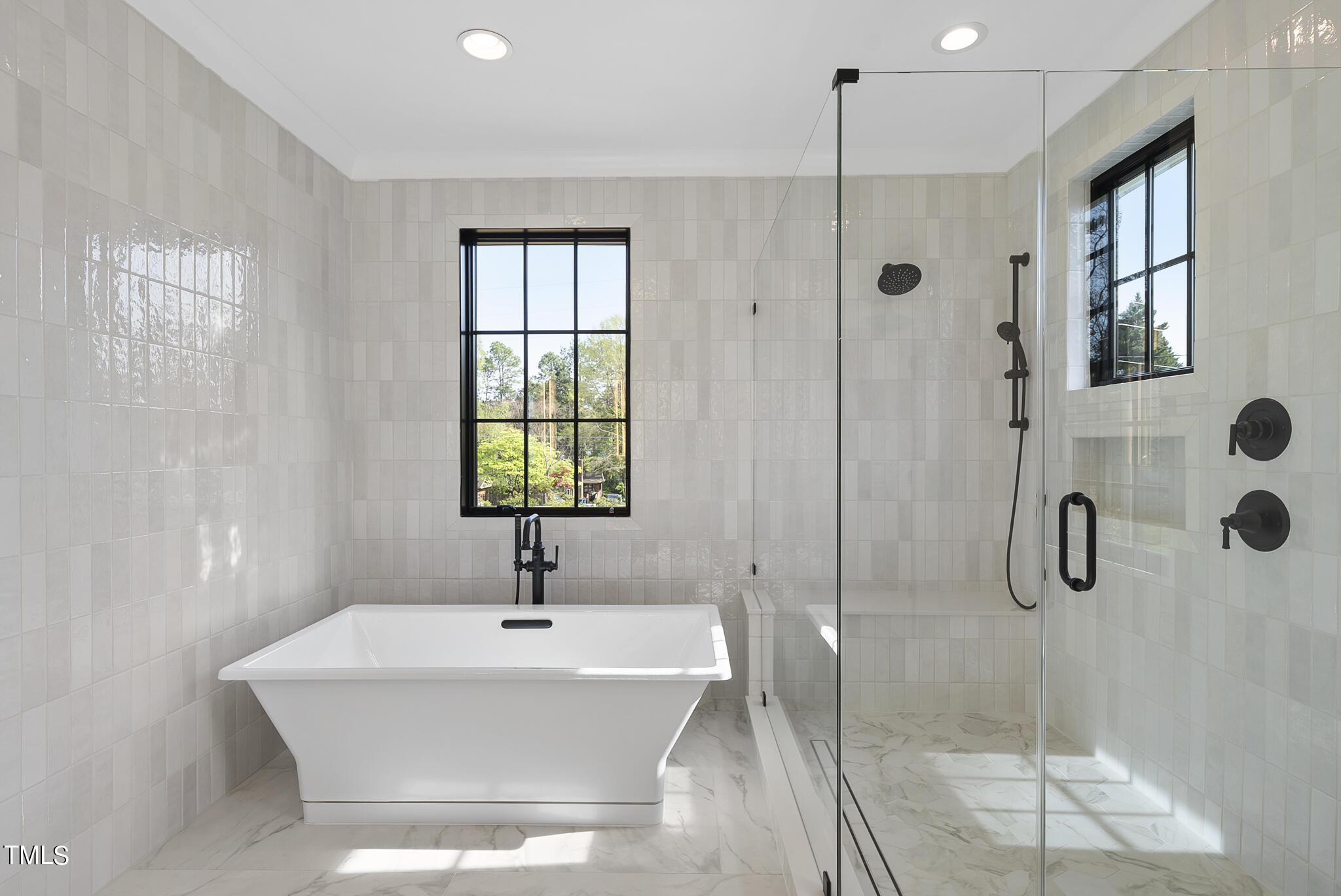 3305 Founding Place Raleigh, NC 27612 - Photo 30 of 100 a bathroom with a bathtub a shower and a sink