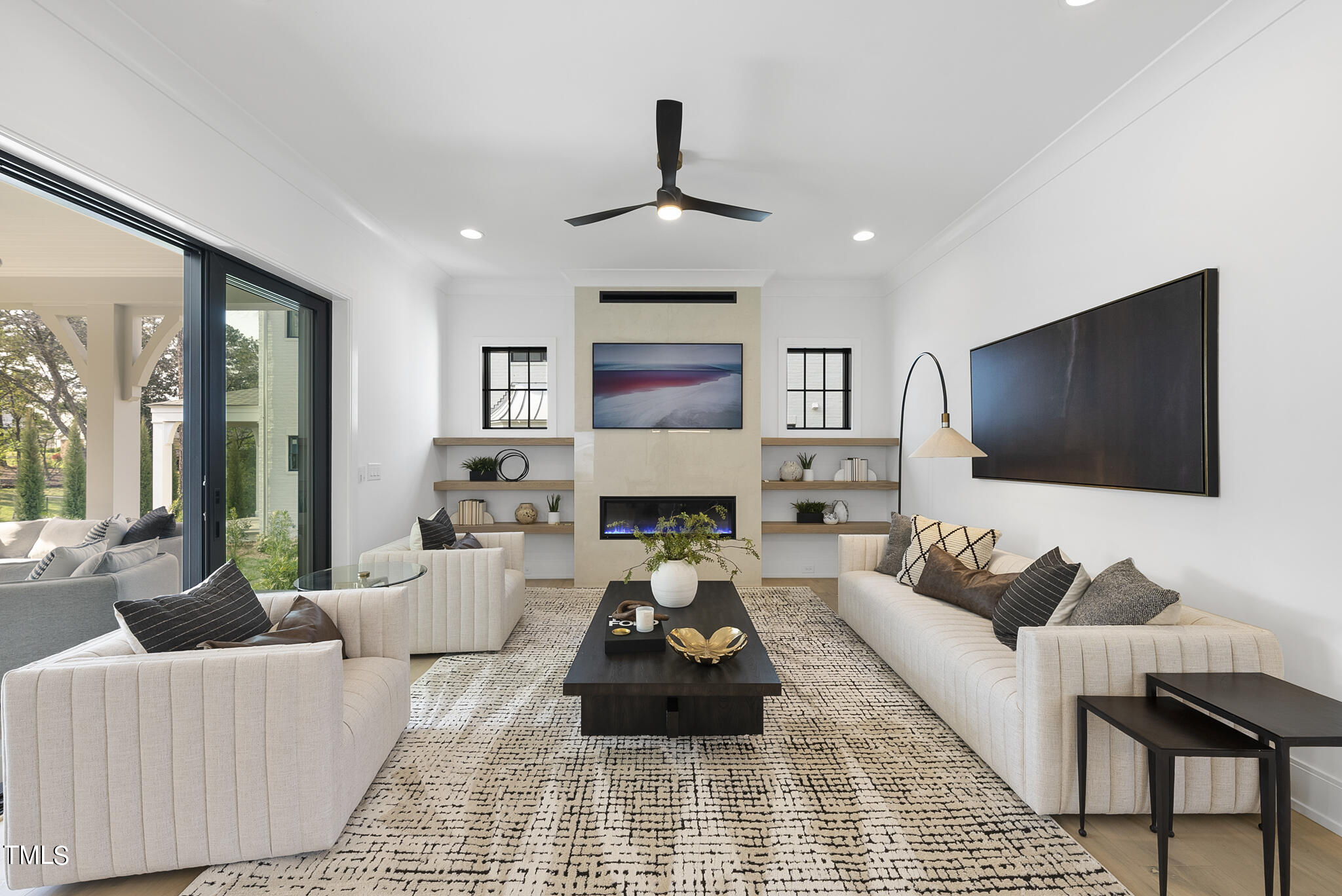 3305 Founding Place Raleigh, NC 27612 - Photo 36 of 100 a living room with furniture and a flat screen tv