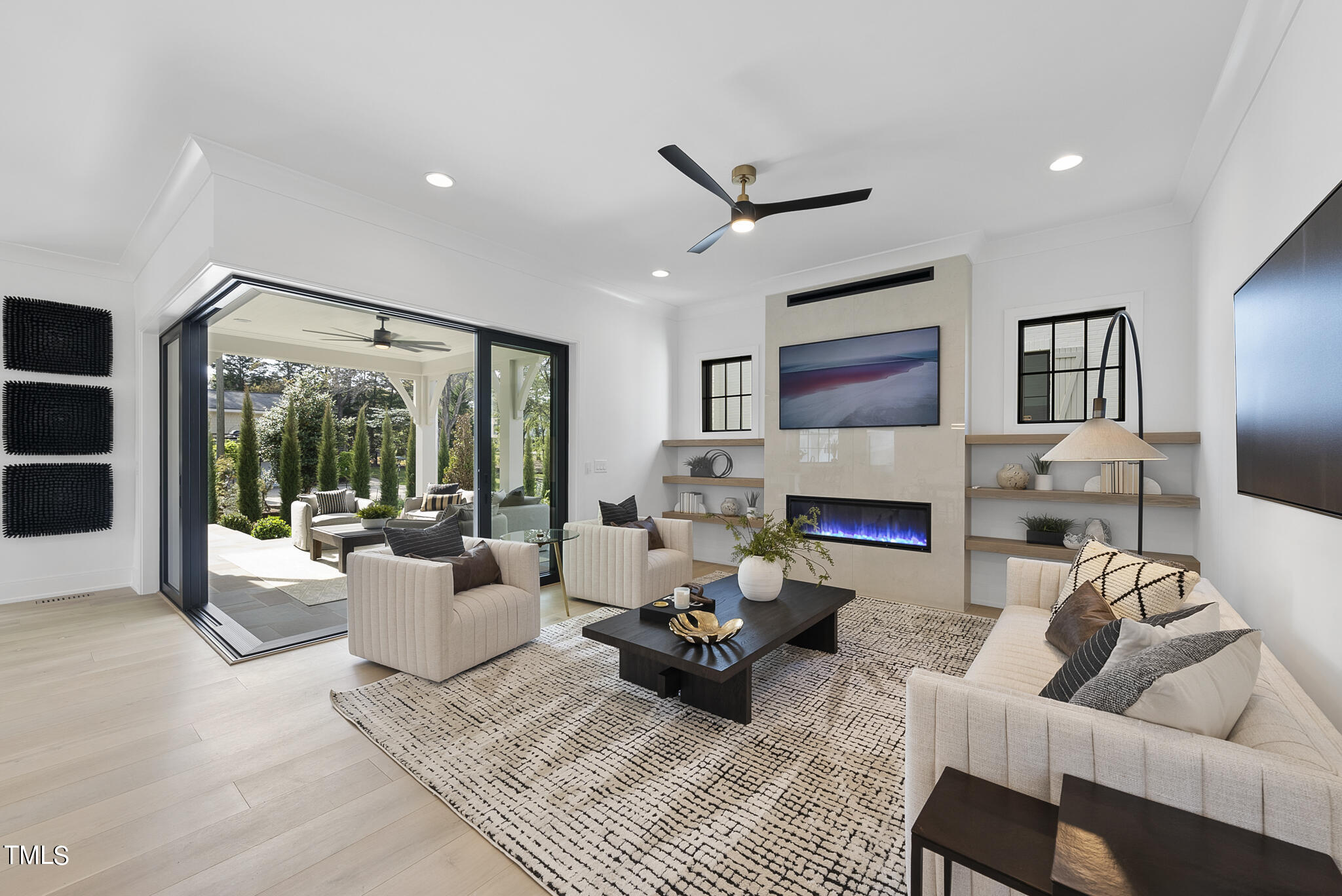 3305 Founding Place Raleigh, NC 27612 - Photo 37 of 100 a living room with furniture large window and a fireplace