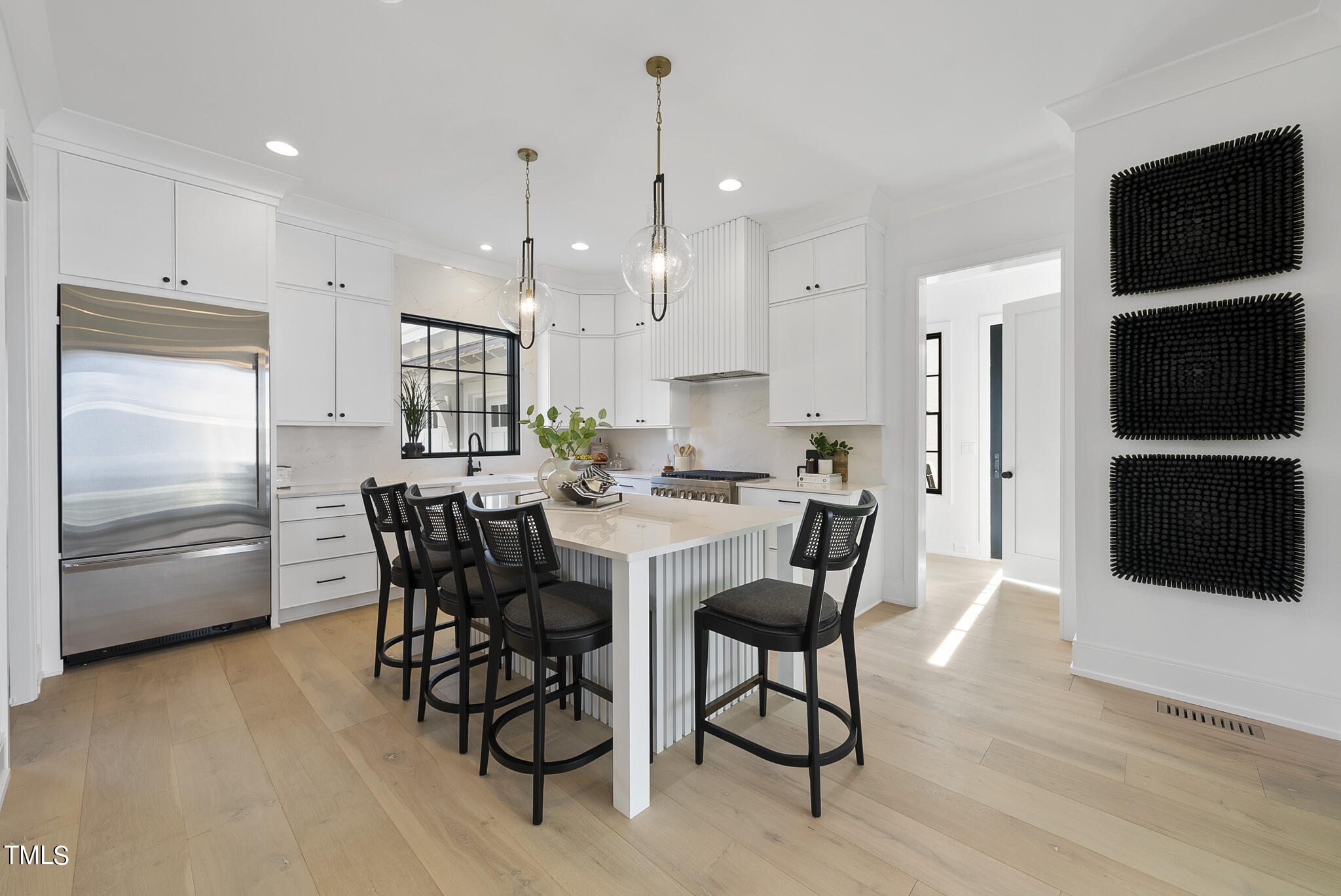 3305 Founding Place Raleigh, NC 27612 - Photo 39 of 100 a kitchen with stainless steel appliances a dining table chairs and refrigerator