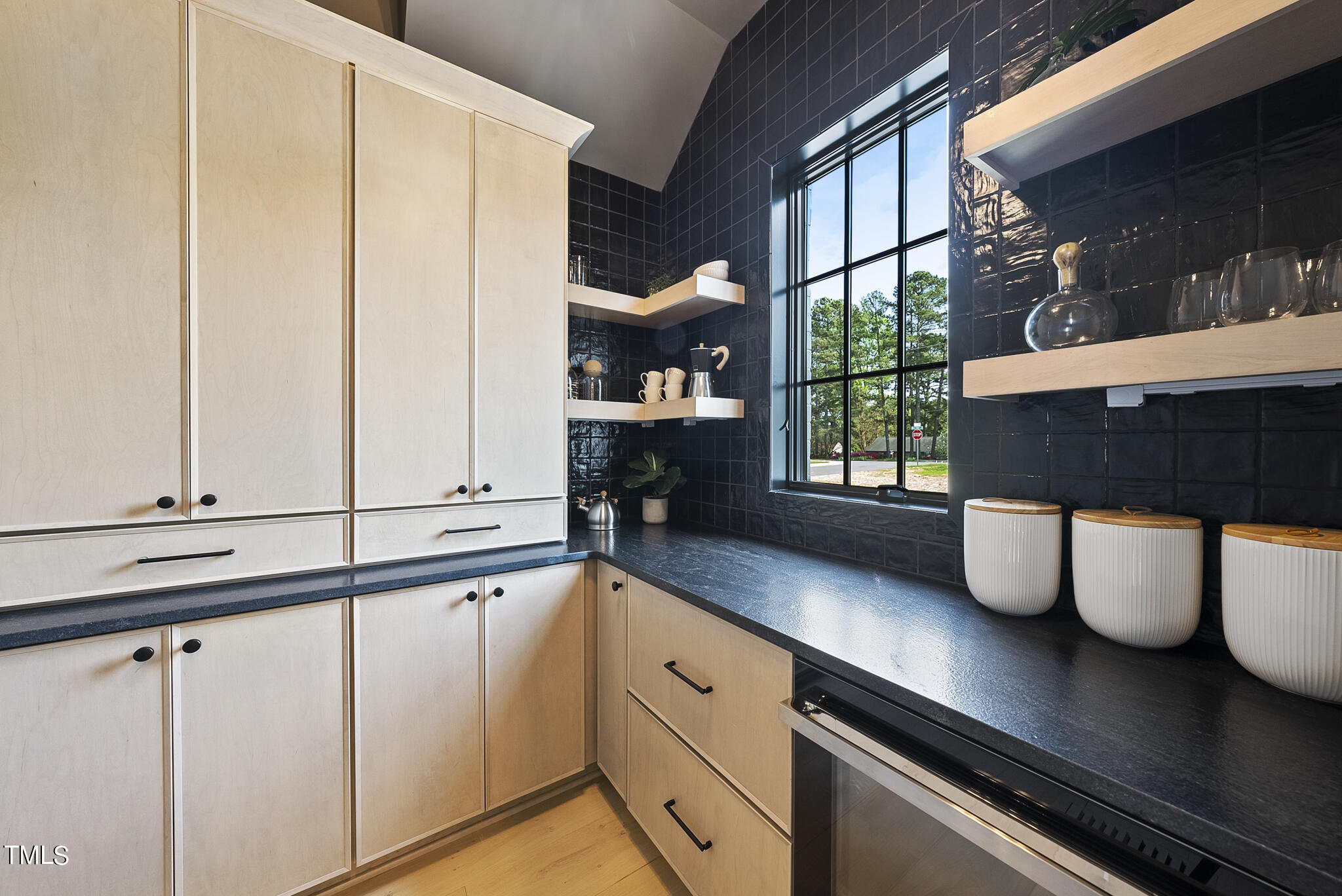 3305 Founding Place Raleigh, NC 27612 - Photo 44 of 100 a kitchen with stainless steel appliances granite countertop a sink a stove and a window